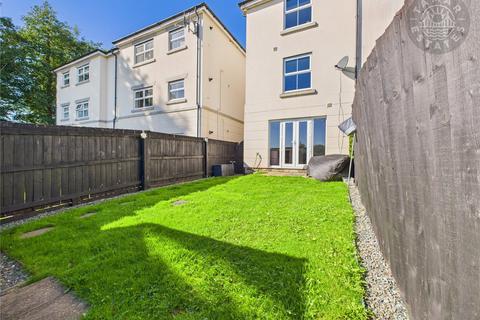 undefined, “An attractive and well-designed townhouse, perfect for families, with four bedrooms and two allocated parking spaces.”