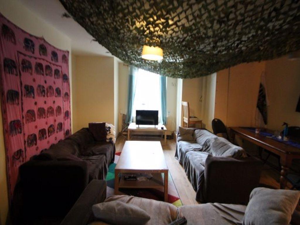 A cozy living room with comfortable seating, a ...