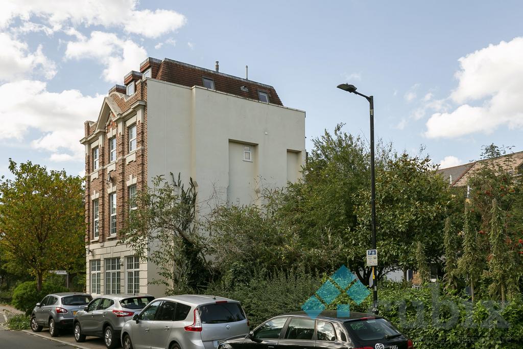Street scene with property, parking