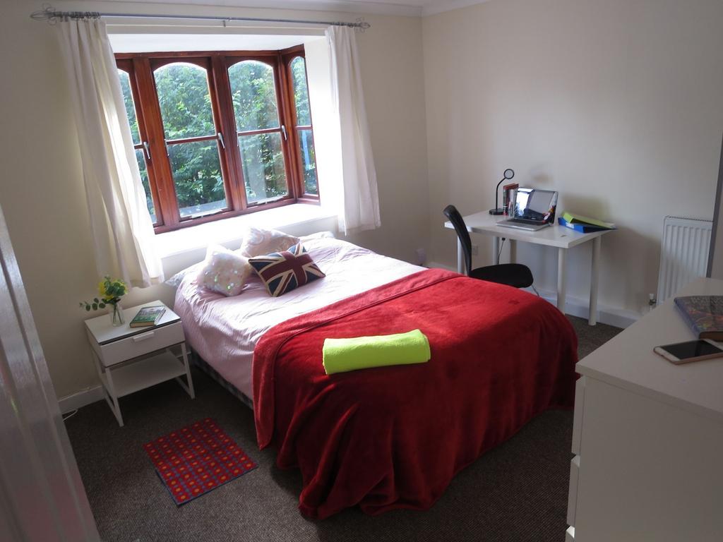 Bright and welcoming bedroom featuring a large ...