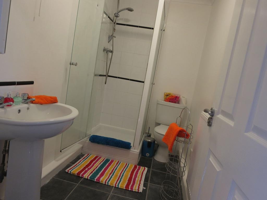 A clean and functional bathroom featuring a sin...