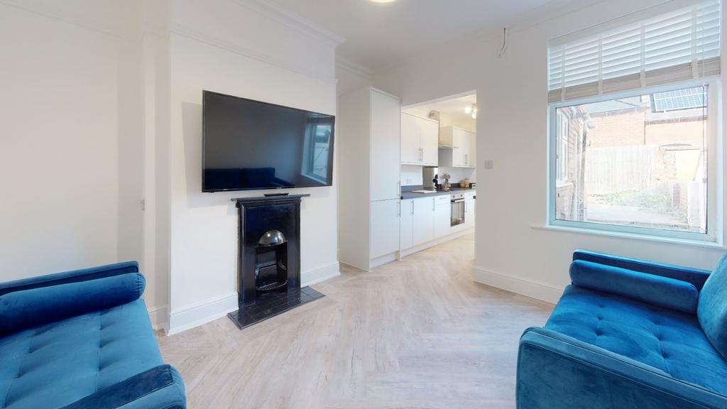 Bright and airy living room featuring contempor...