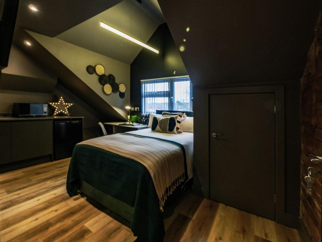 Modern and stylish bedroom with a cozy double b...