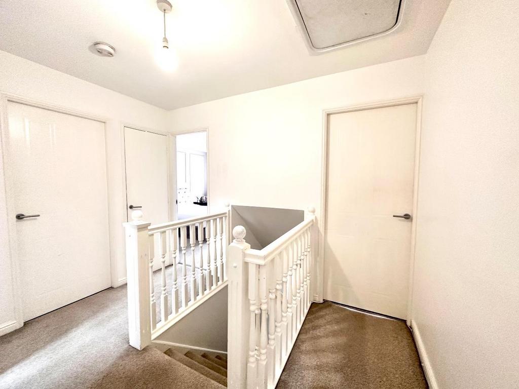 Staircase rises to first floor
