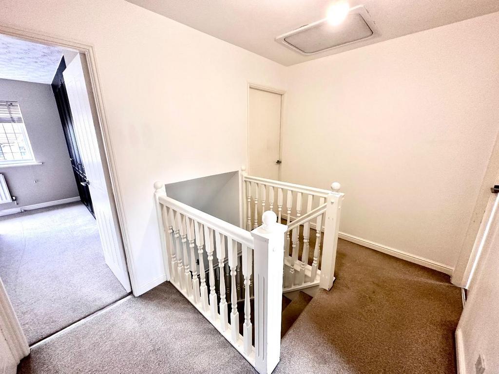 Staircase rises to first floor
