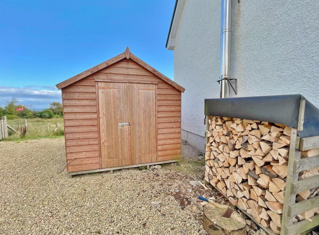 Timber shed and log store