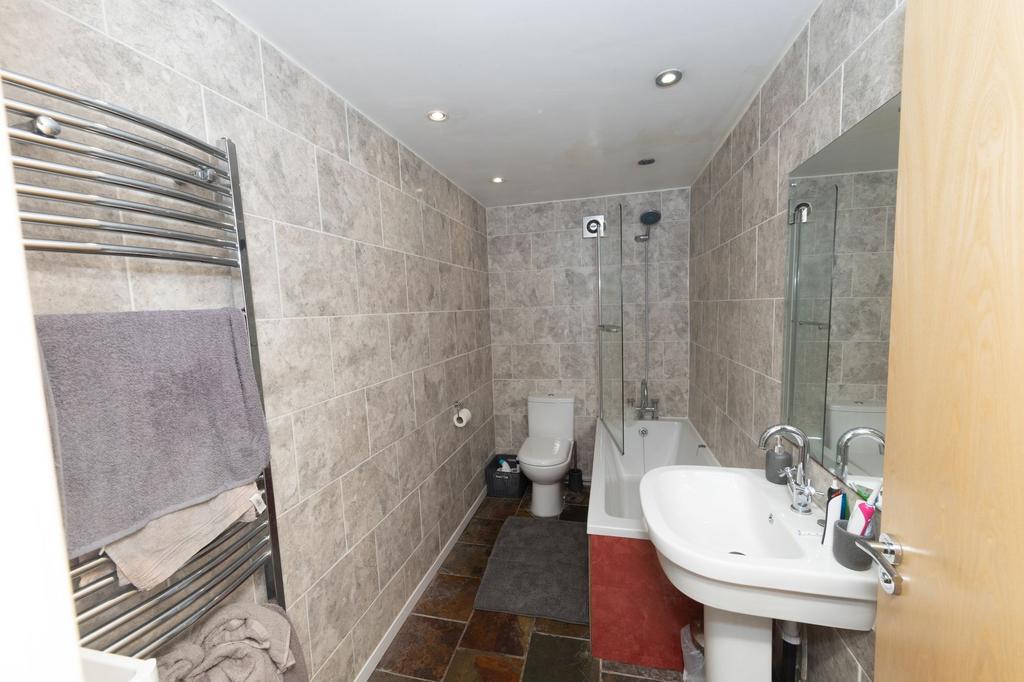 A modern, well-maintained bathroom featuring a ...