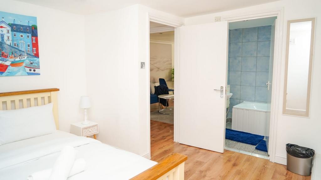 Bright and clean double bedroom featuring crisp...