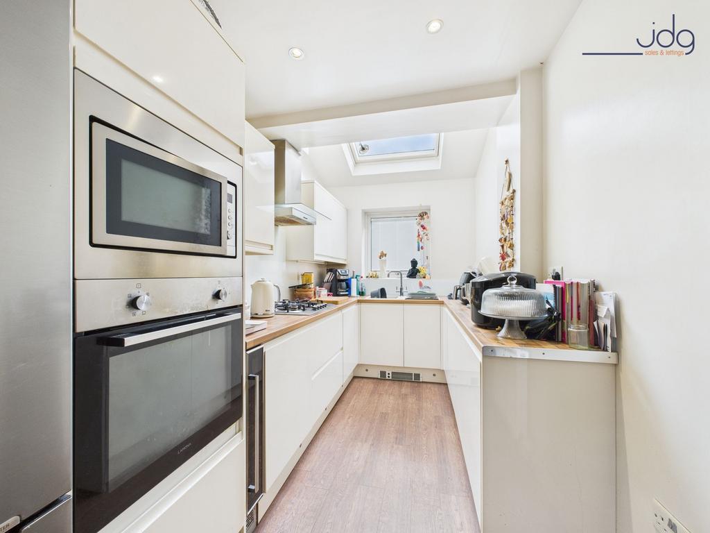 Galley-Style Kitchen with sky light