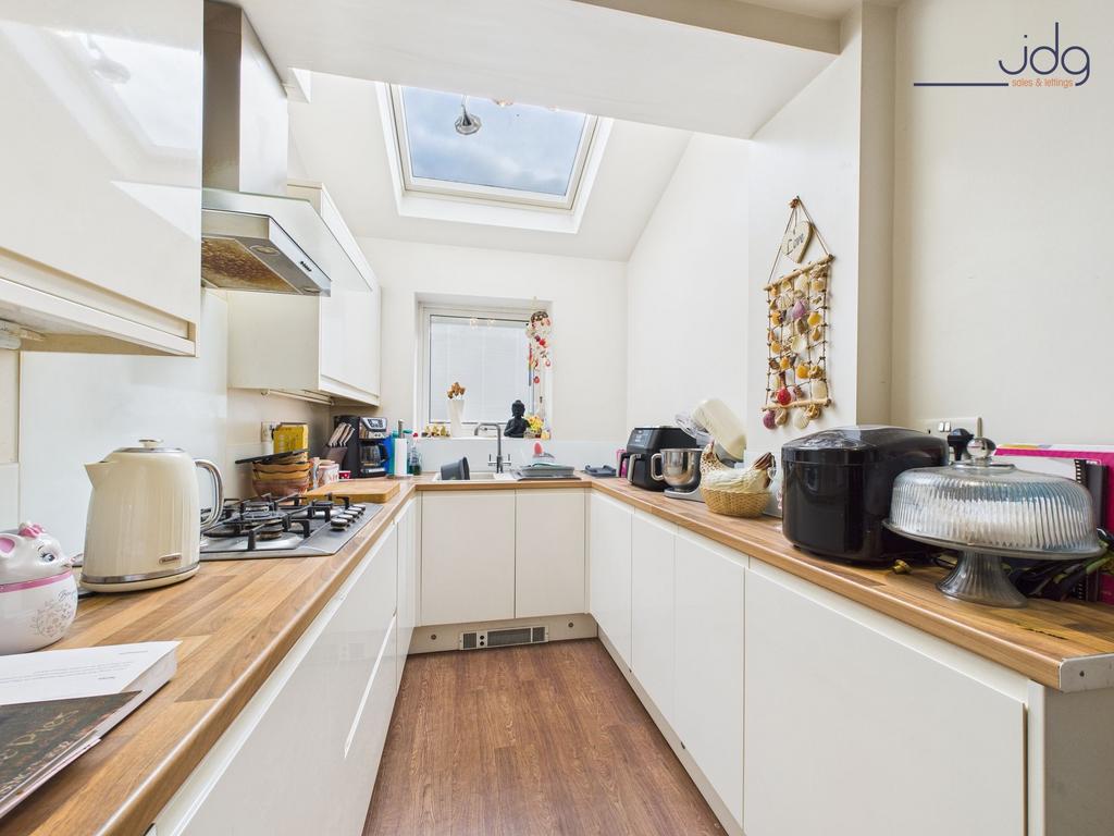 Galley-Style Kitchen with sky light