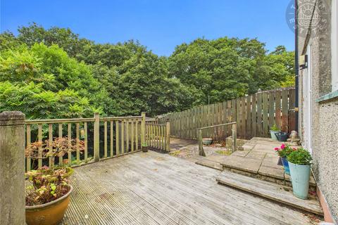 undefined, “Spacious end-terrace in a sought-after coastal town.”
