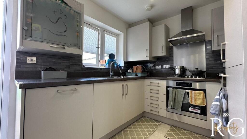 A bright and tidy kitchen with modern cabinetry...