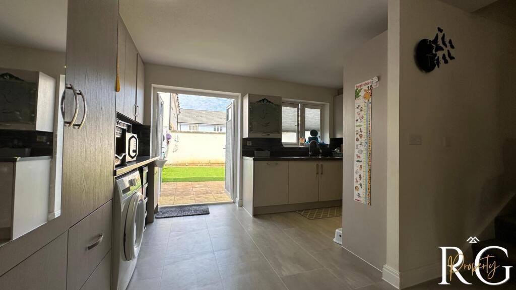 Bright and modern kitchen with ample natural li...