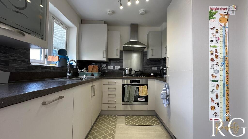 A bright and well-maintained kitchen featuring ...