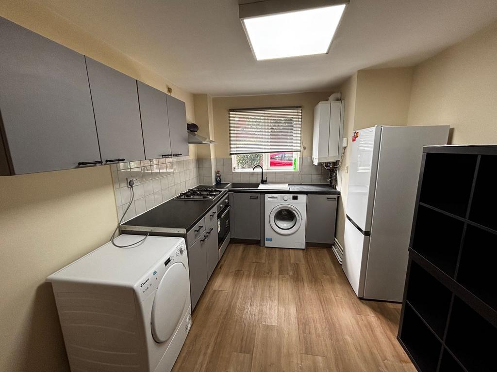 A modern, well-maintained kitchen featuring sle...