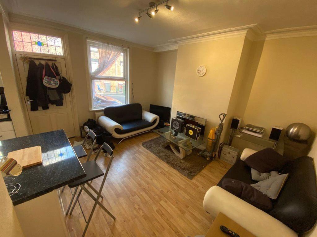 A bright and inviting living room featuring two...