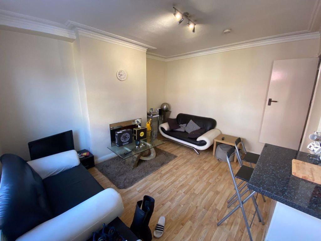 A spacious and well-maintained living room feat...