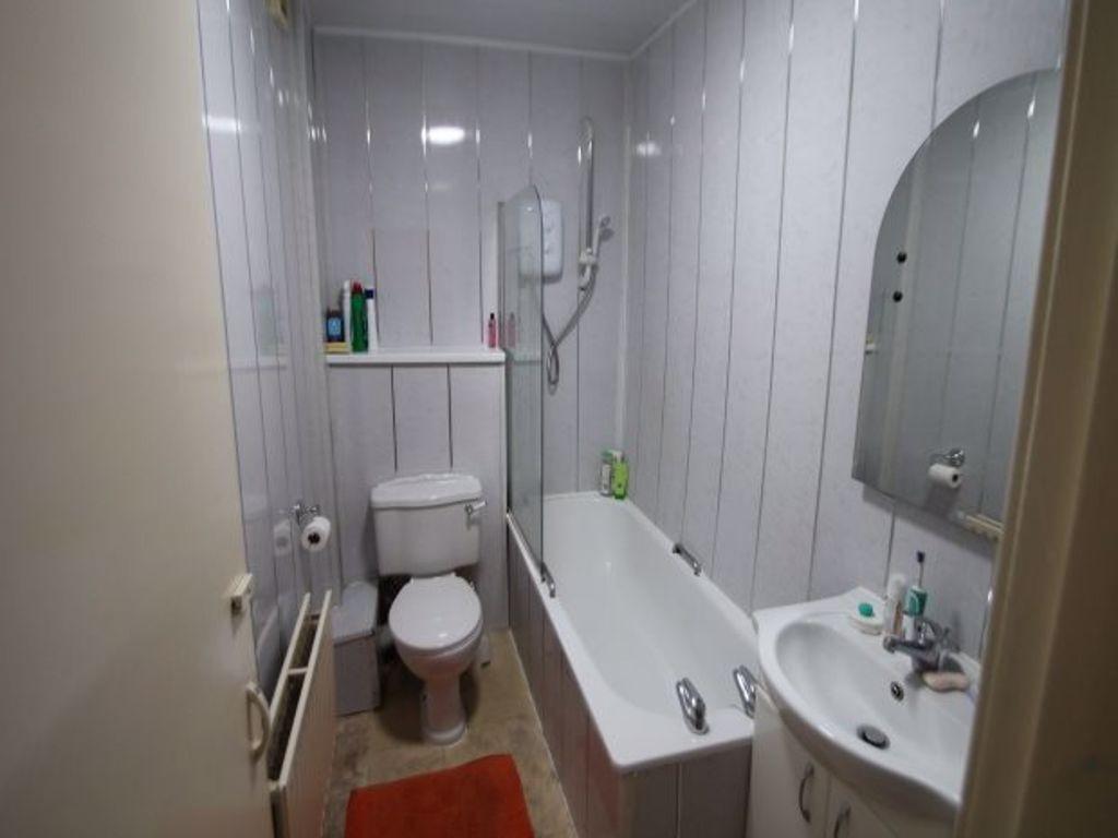 A clean and well-maintained bathroom featuring ...