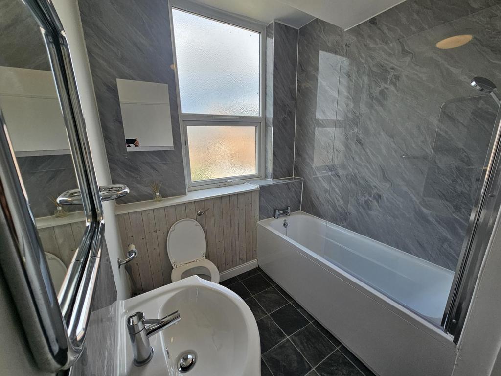 A modern, well-maintained bathroom featuring a ...