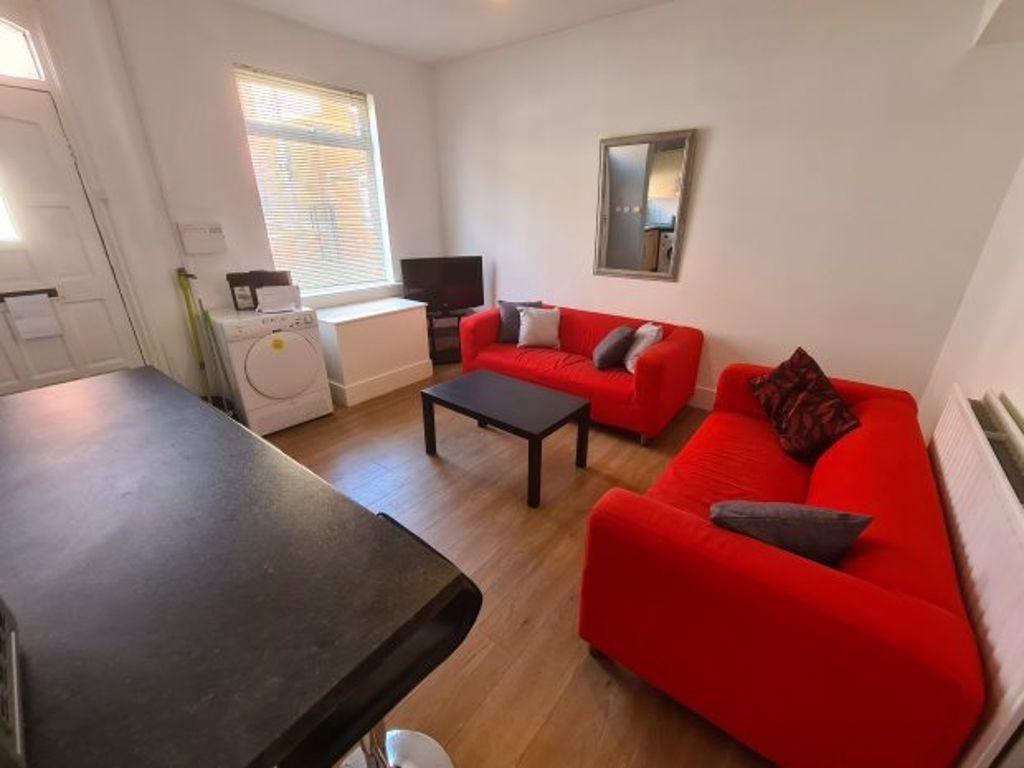 A bright and welcoming living room featuring vi...