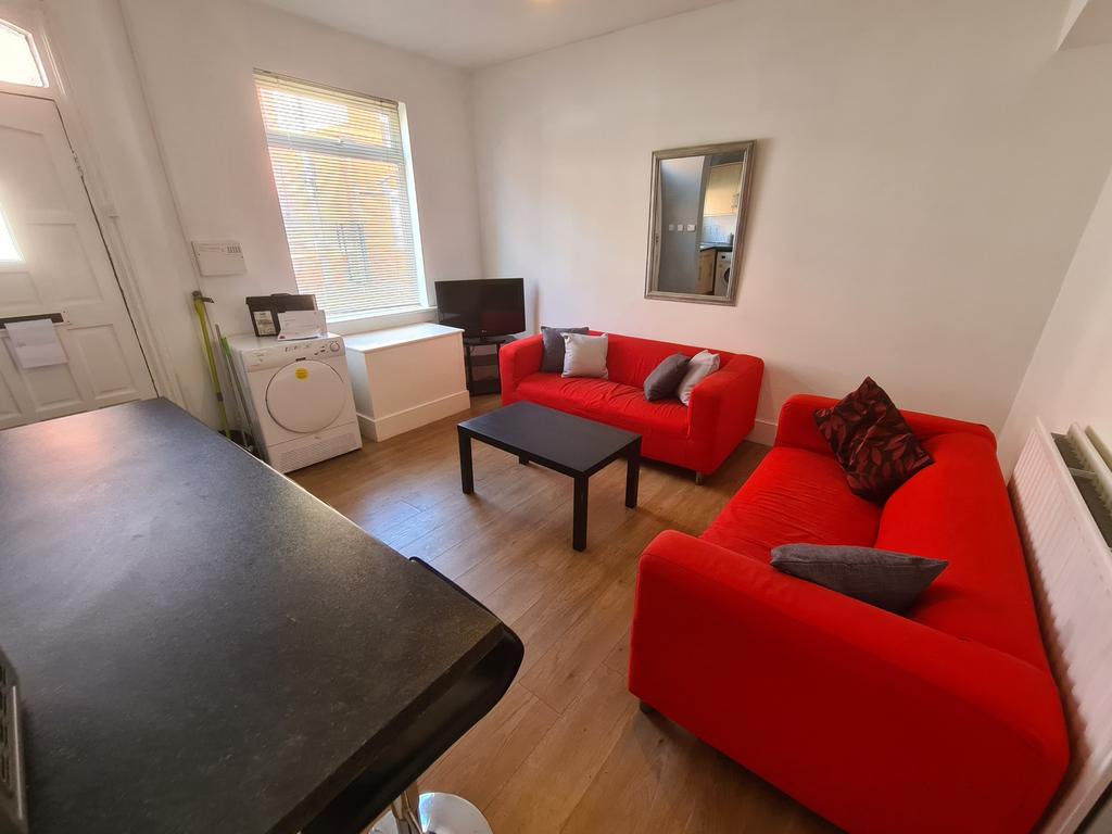 Bright and inviting living room featuring vibra...