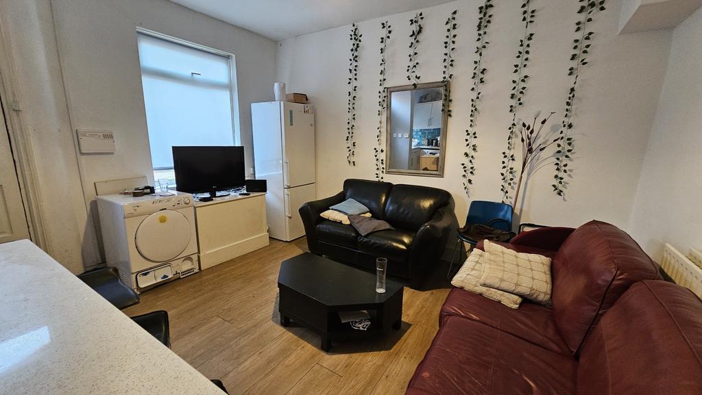 A cozy living room featuring a comfortable sofa...