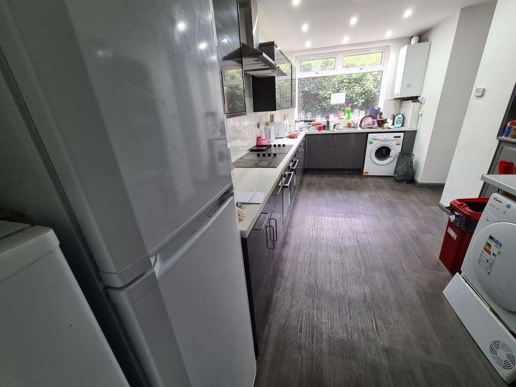 Bright and modern kitchen featuring ample count...