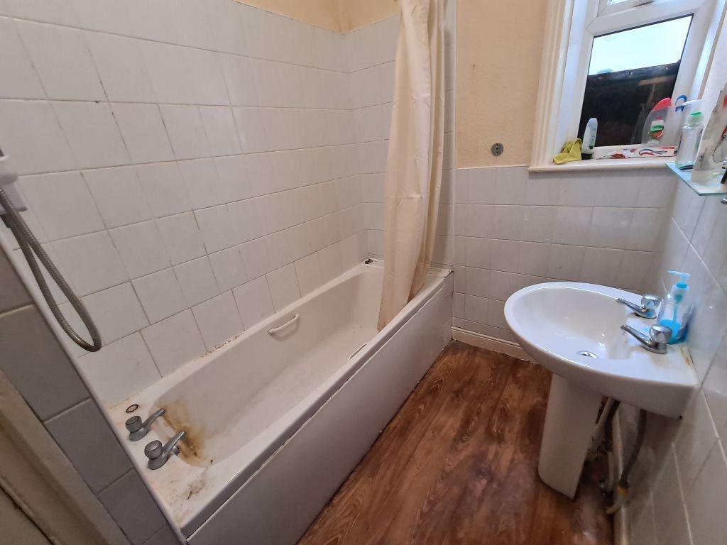 A clean and functional bathroom featuring a bat...