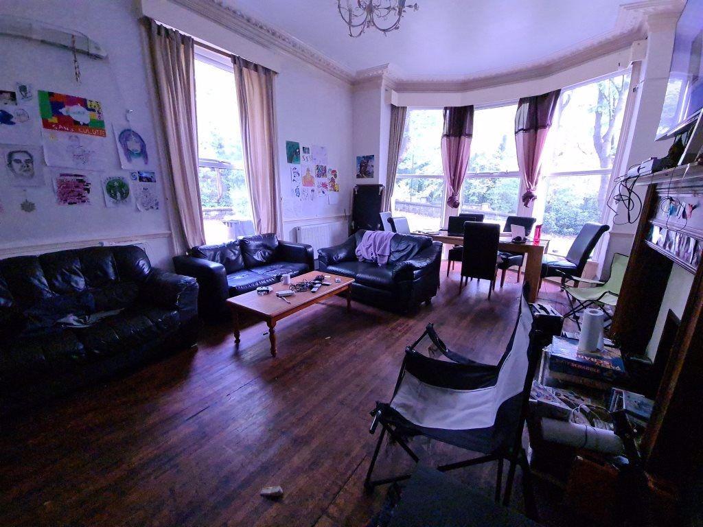 A welcoming living room featuring multiple larg...