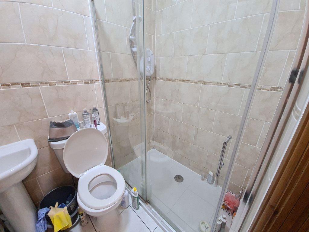 A well-maintained bathroom featuring a spacious...