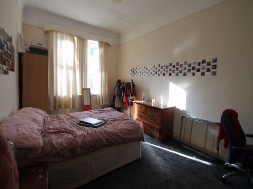A cozy double bedroom featuring a comfortable d...