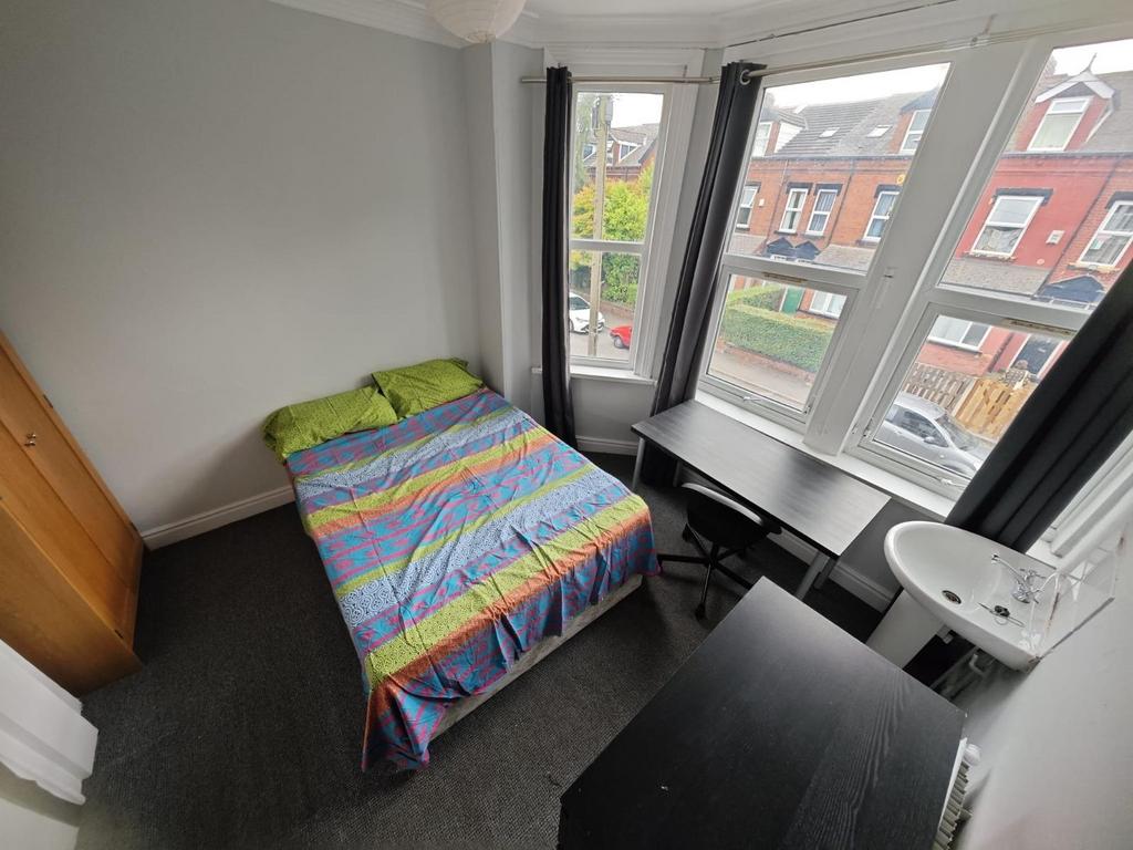 Bright and cozy double bedroom featuring a comf...