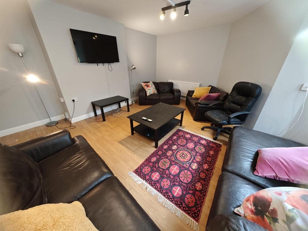 A cozy and inviting living room featuring comfo...