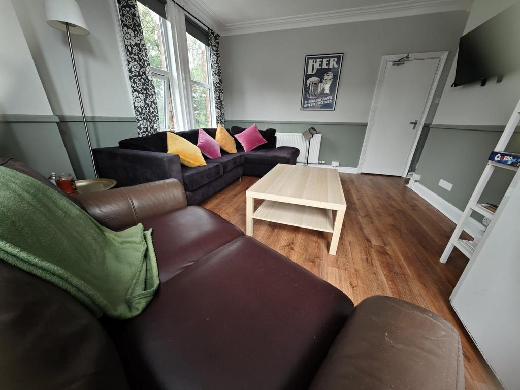 A cozy and inviting living room featuring comfo...