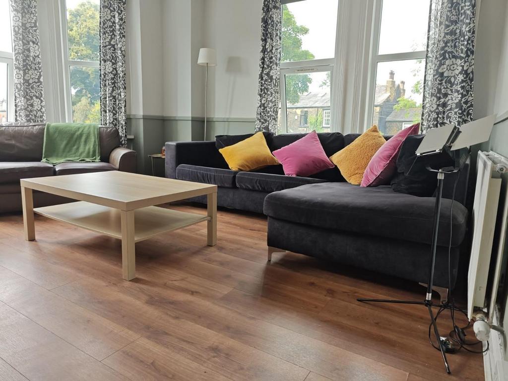 Bright and inviting living room featuring a lar...