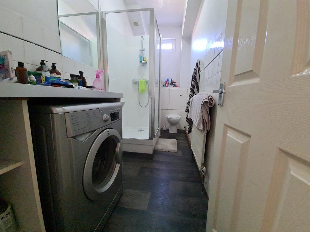 A clean, well-maintained bathroom with a shower...