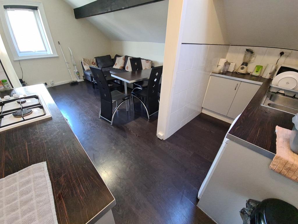 A modern kitchen with ample workspace, clean co...