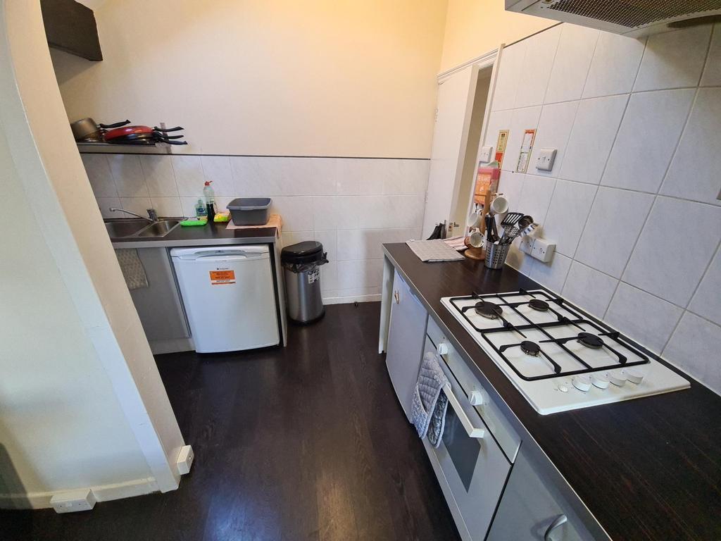 A compact but functional kitchen area featuring...