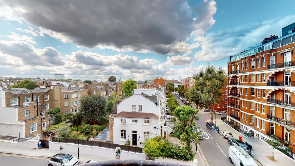 A bright and inviting street view featuring cha...