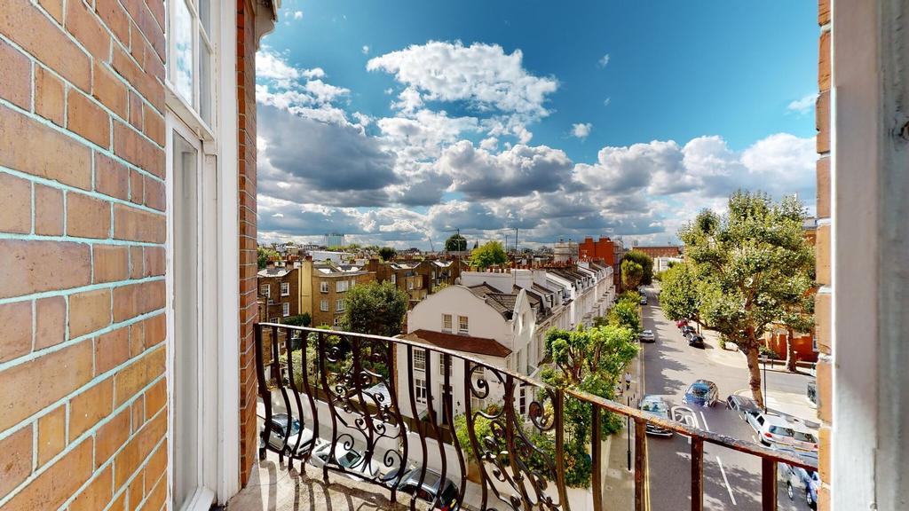 A charming view from a balcony overlooking a pe...