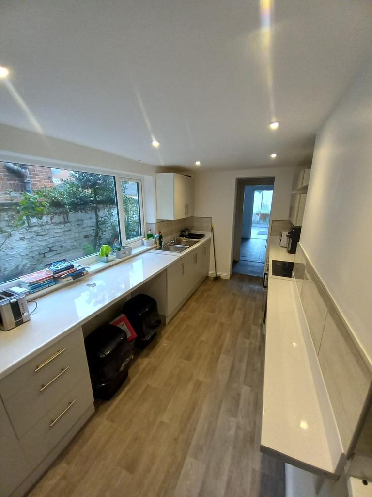 Bright and functional kitchen with a large wind...