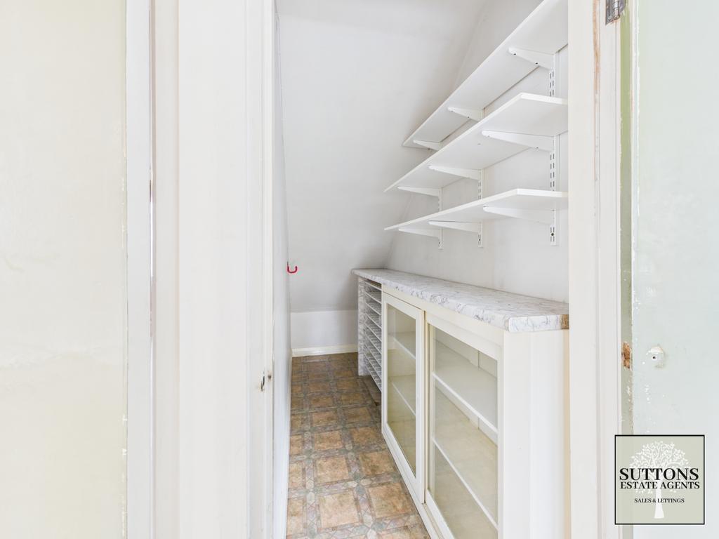 Pantry under stairs