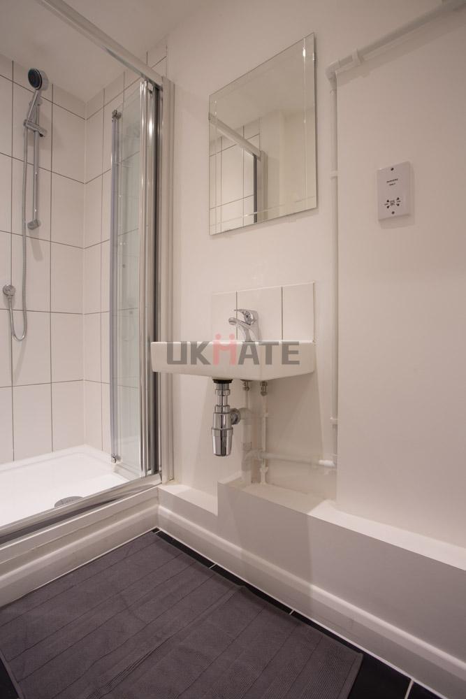 A modern and clean bathroom featuring a compact...