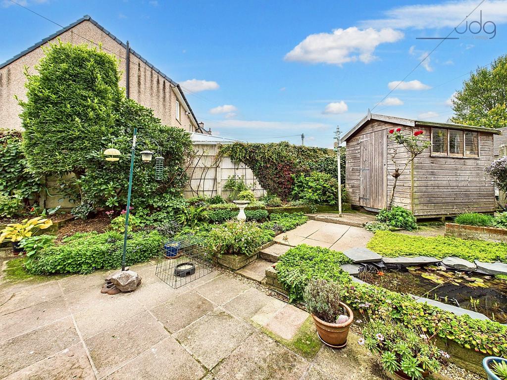 Spacious Flagged Garden with Mature Shrubs and...