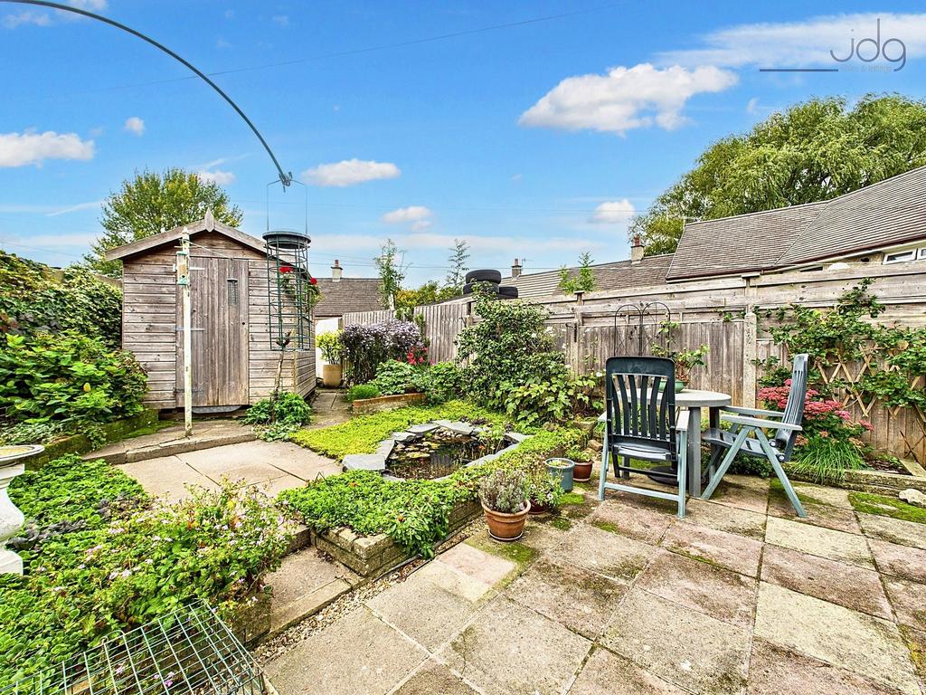 Spacious Flagged Garden with Mature Shrubs and...