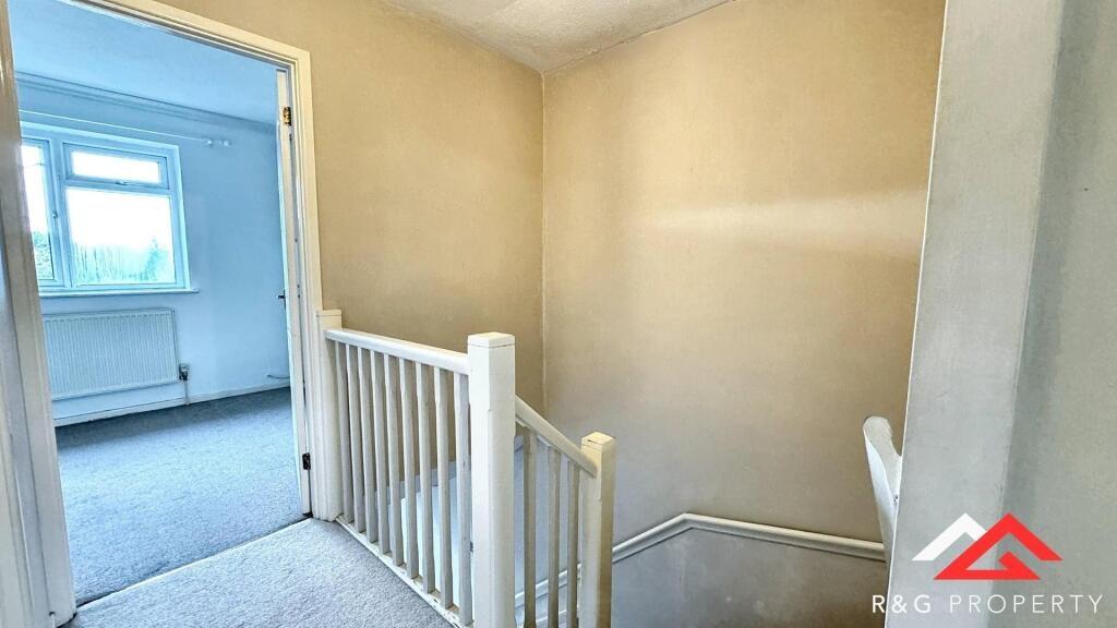 Bright and clean hallway space with light-color...