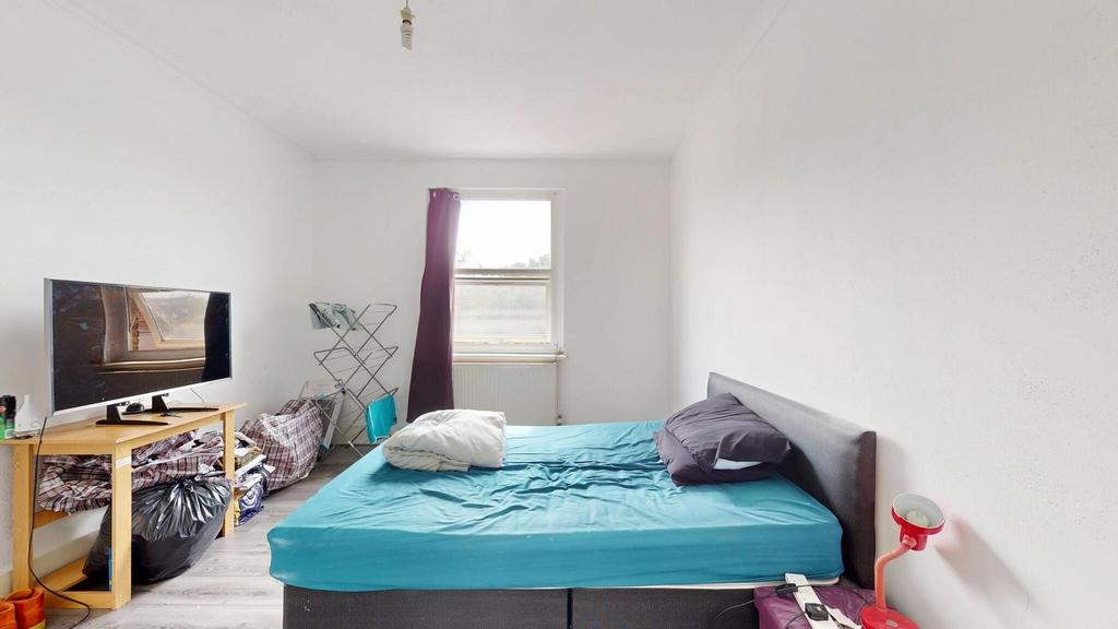 A bright, minimalist living space featuring a b...