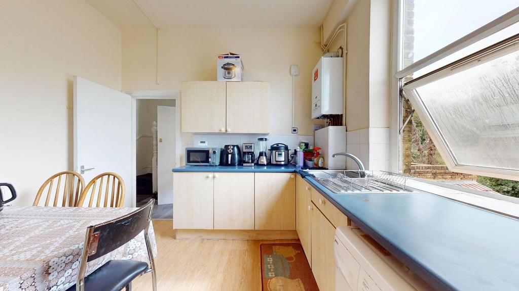 Bright and inviting kitchen featuring a large w...
