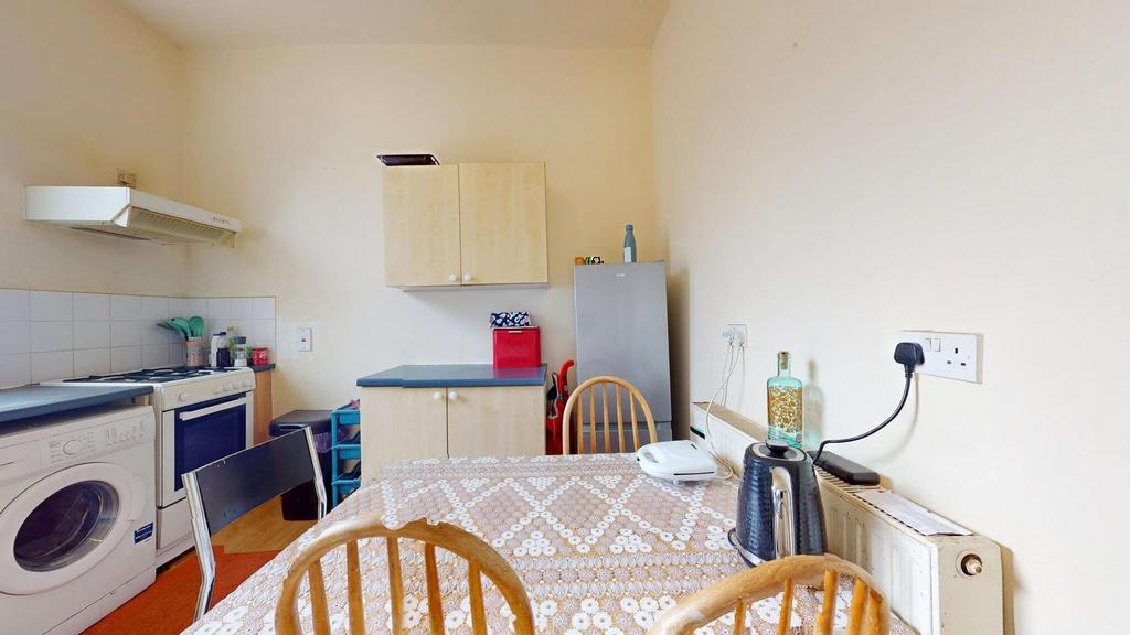 A functional kitchen area featuring essential a...