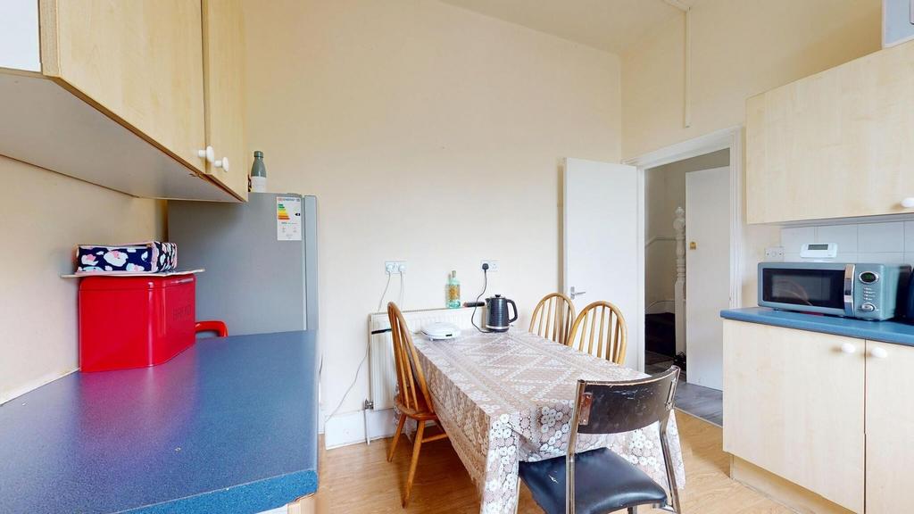 A bright and functional kitchen area featuring ...